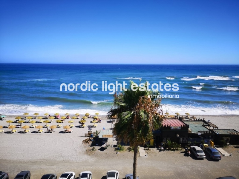 Beachfront apartment with parking space and store room