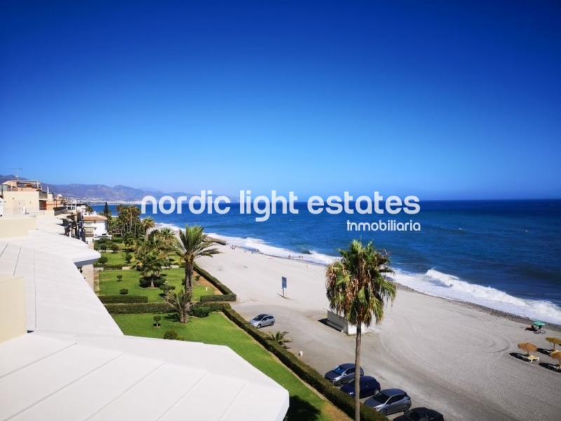 Beachfront apartment with parking space and store room