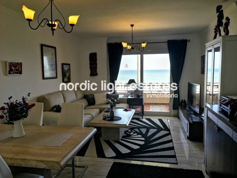 Beachfront apartment with parking space and store room