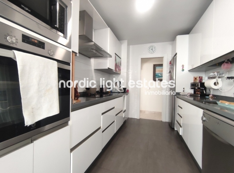 Renovated top floor apartment with 100 sqm terrace and parking space
