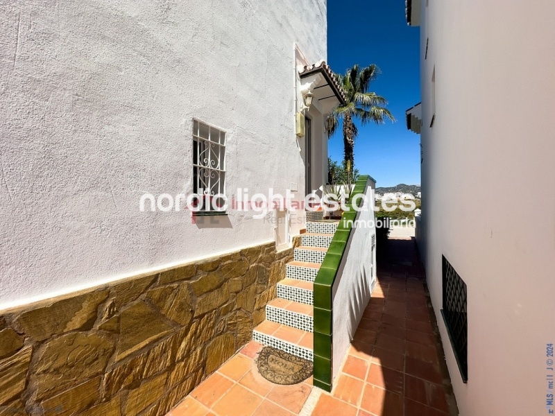 Semi detached terraced house directly opposite the sea in Torrox Costa