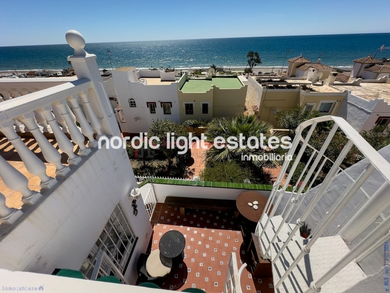 Semi detached terraced house directly opposite the sea in Torrox Costa