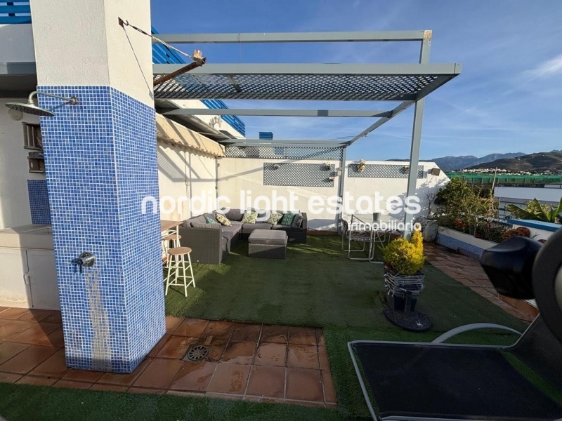 Beachfront living at its finest with this stunning penthouse duplex in Torrox Costa 