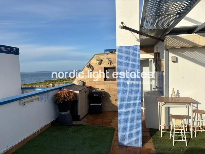 Beachfront living at its finest with this stunning penthouse duplex in Torrox Costa 