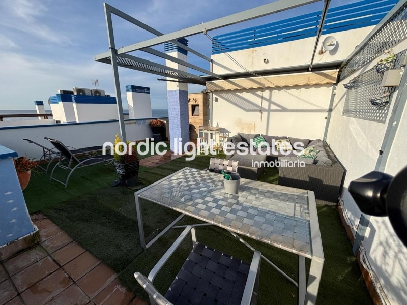 Beachfront living at its finest with this stunning penthouse duplex in Torrox Costa 
