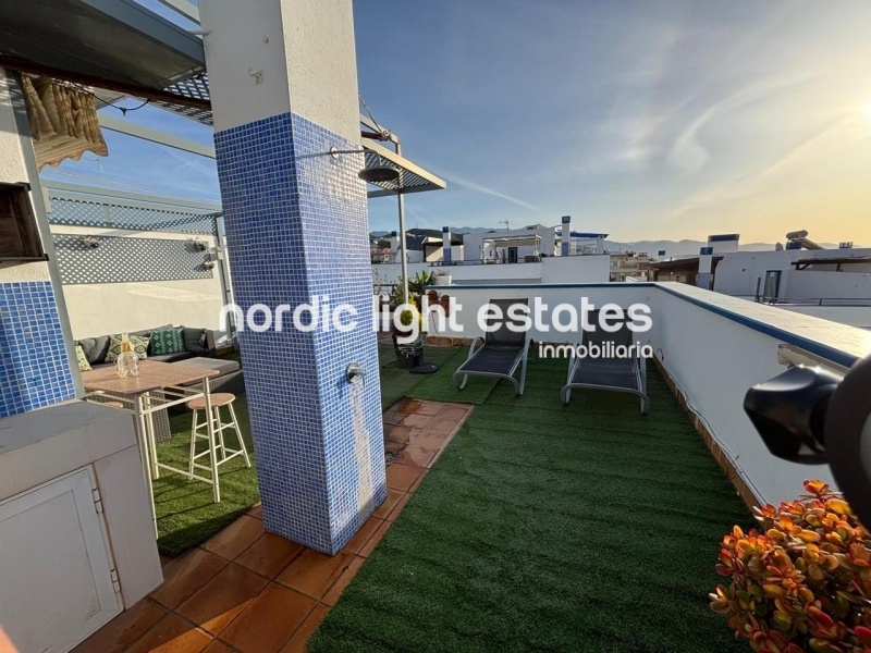 Beachfront living at its finest with this stunning penthouse duplex in Torrox Costa 