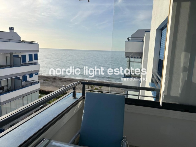 Beachfront living at its finest with this stunning penthouse duplex in Torrox Costa 