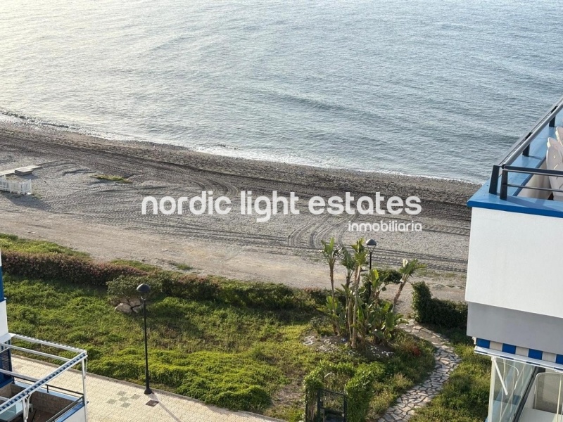 Beachfront living at its finest with this stunning penthouse duplex in Torrox Costa 