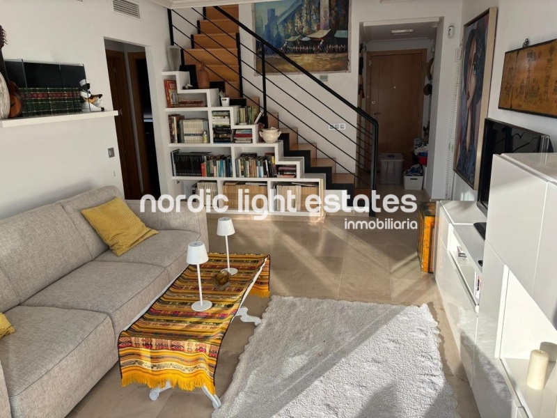 Beachfront living at its finest with this stunning penthouse duplex in Torrox Costa 