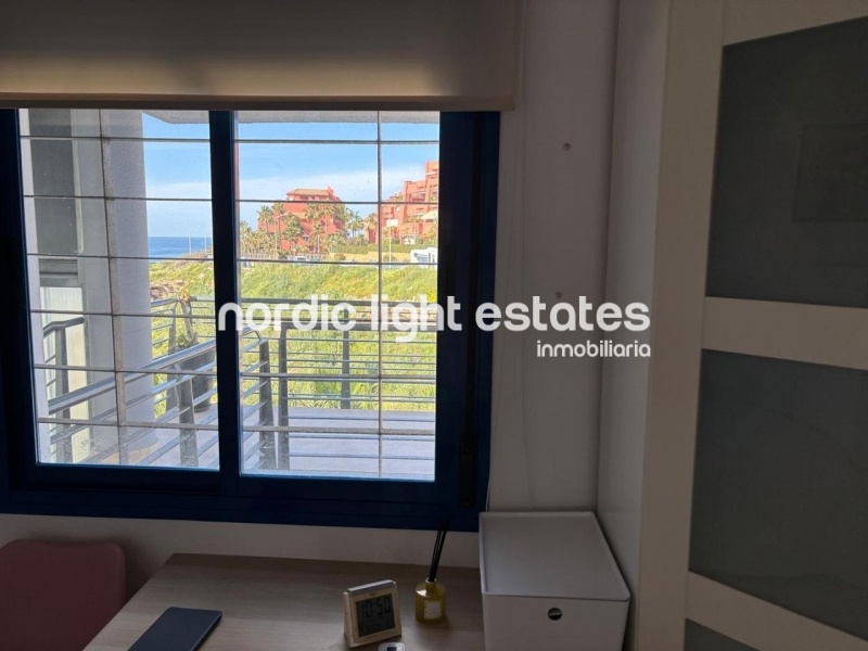 Beachfront living at its finest with this stunning penthouse duplex in Torrox Costa 