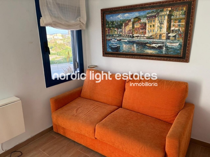 Beachfront living at its finest with this stunning penthouse duplex in Torrox Costa 