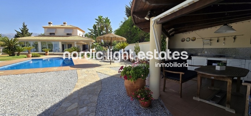 Exceptional villa with landscaped gardens, a pool, 2 enclosed garages, a sauna and much more