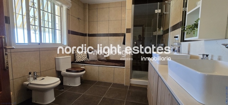 Exceptional villa with landscaped gardens, a pool, 2 enclosed garages, a sauna and much more