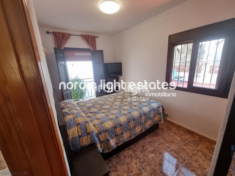 Apartment with exceptional outdoor areas in the center of Frigiliana