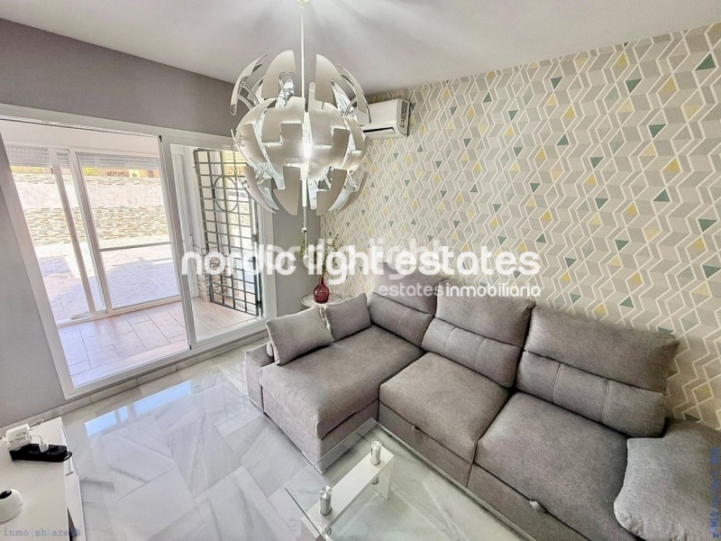 Elegante apartamento de esquina con terraza de 100m2